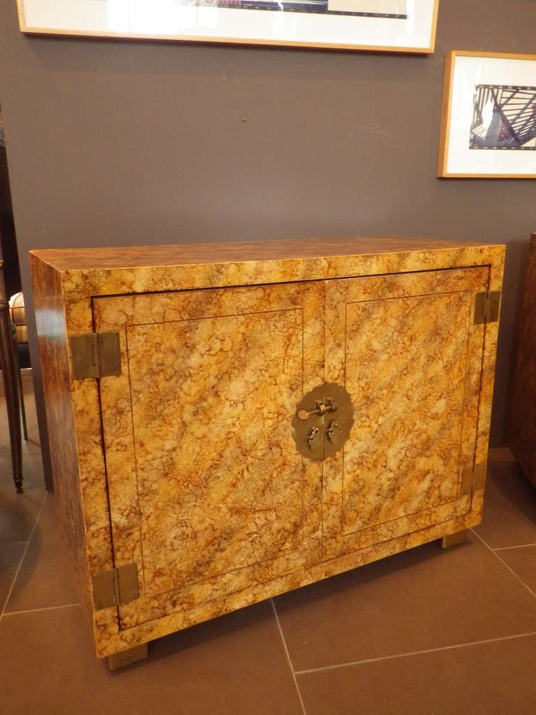 Beautiful pair of oil spot lacquer credenzas with decorative brass pulls and hinges.