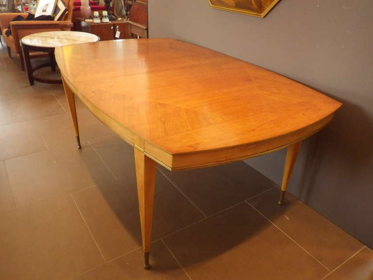 Beautiful Dining table (leaves included). Hybrid oval and rectangular shaped with brass inlay throughout. 