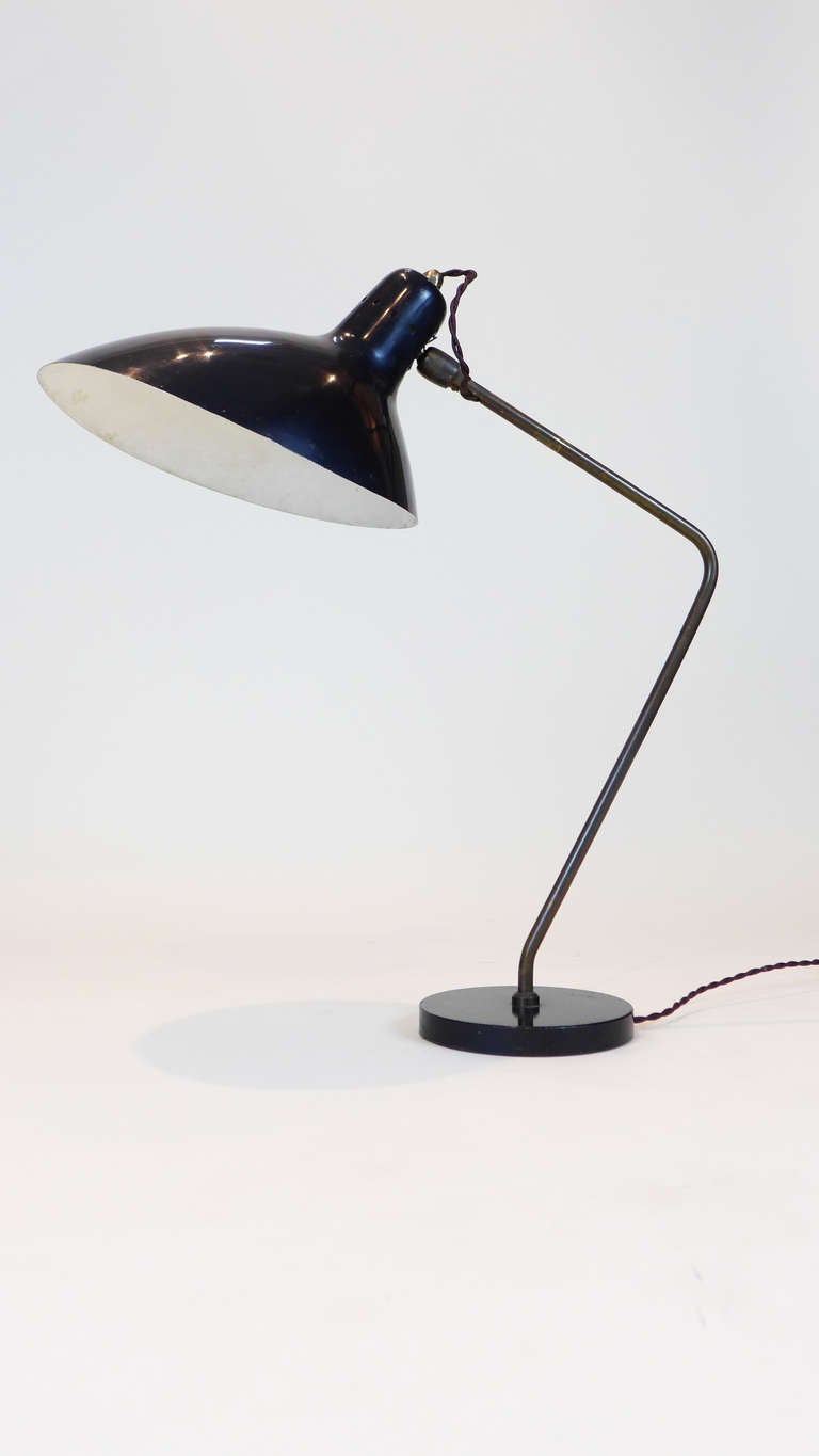 Exceptional table lamp attributed to Jean Boris Lacroix circa 1950s. Round base in black lacquered metal, brass rod bent, big ball brass and lacquered high mobile cap black outside and white inside. Original lacquer and patina.