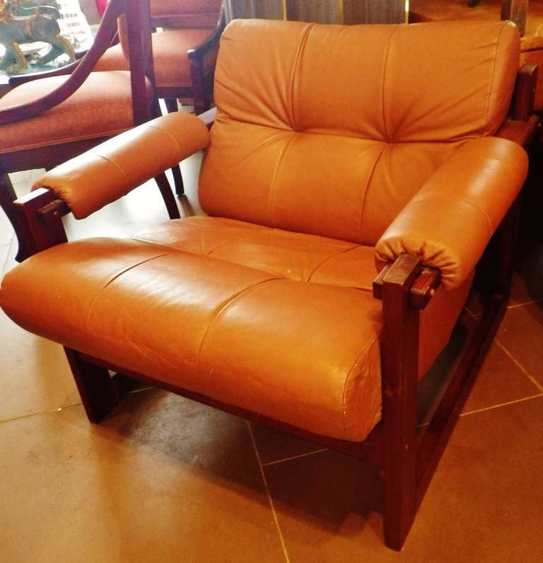 Elegant chair with leather upholstery on a solid wood frame. 