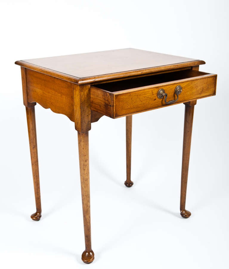 Simply Stylish an English Queen Anne Style Carved Maple side table with Drawer & Brass Bail.

Early 20th Century