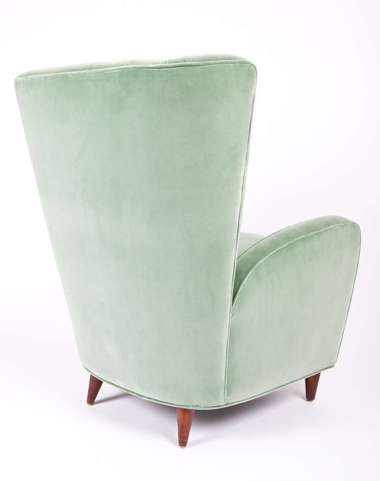 This beautiful pair of lounge chairs by Paolo Buffa hails from the Hotel Bristol in Merano, Italy. The teal velvet upholstery is quite stunning and elegant.