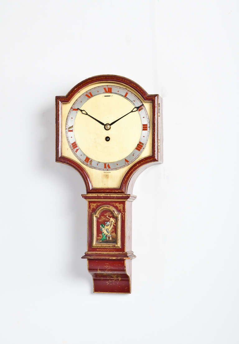 English Chinoiserie Painted Wall Clock by JJ Elliott (London, England) with Swiss Escapement & hand-Painted Brass Dial.

8.75W x 3.75D x 18.25H