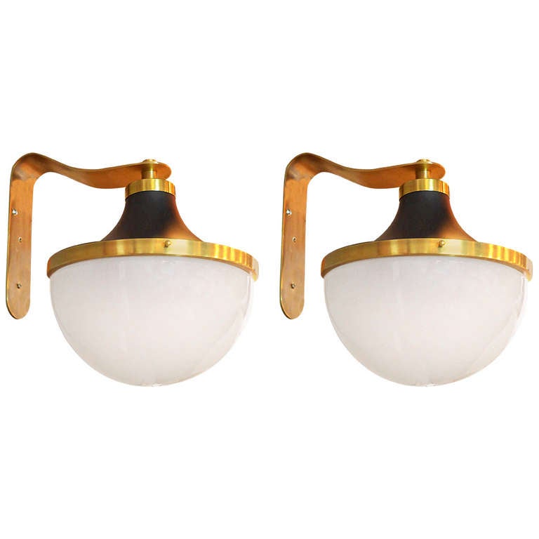 Pair brass and glass sconces by Sergio Mazza for Artemide.

The lamp itself (not including the mount) measures 10.5