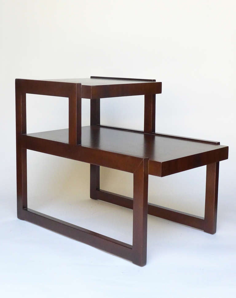 Two-tiered side tables made entirely of solid mahogany. Beautiful dark finish and 