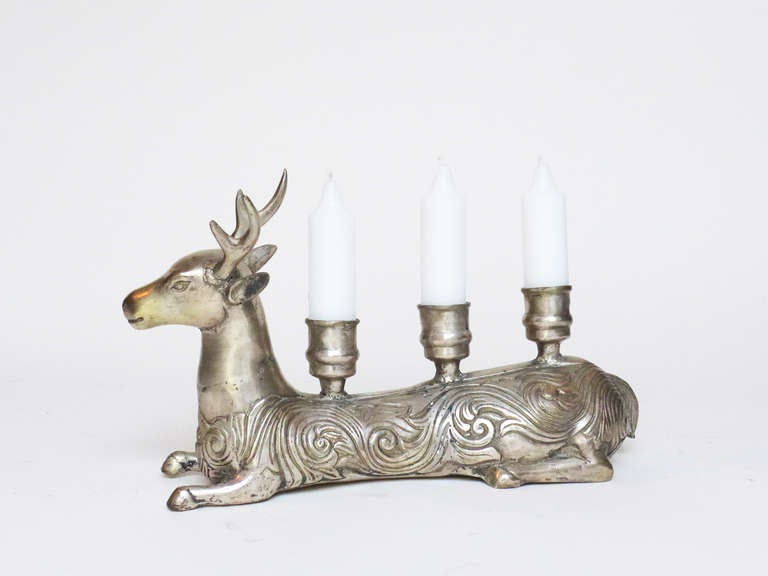Pair of silver plated reindeer with three candlestick holders. Beautiful detail throughout.