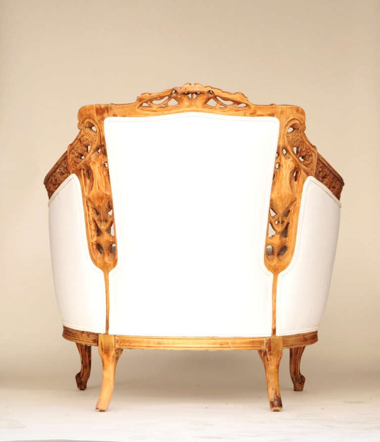 Hand-carved wood frame, wonderfully detailed. Reupholstered in tufted linen. Interesting cameo detailing.

Please contact us in advance if you would like to view this item at our showroom. We have a large inventory and many of our items are stored