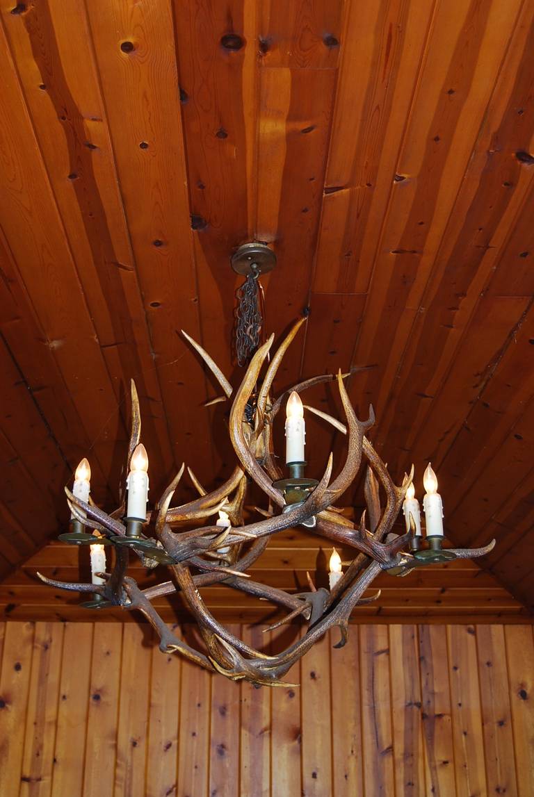 Beautiful vintage chandelier made of antlers. Has eight candelabra sockets.