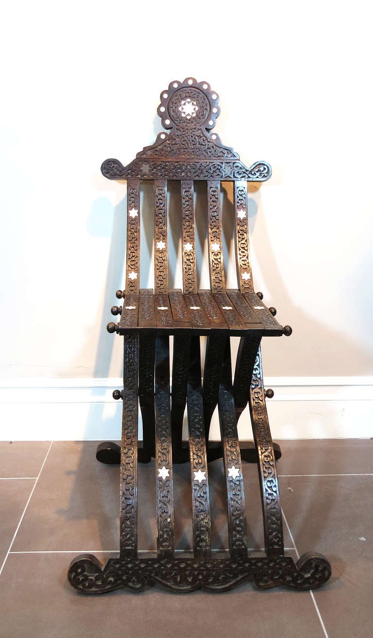 Pair of Moroccan Carved Folding Chairs In Excellent Condition In Los Angeles, CA
