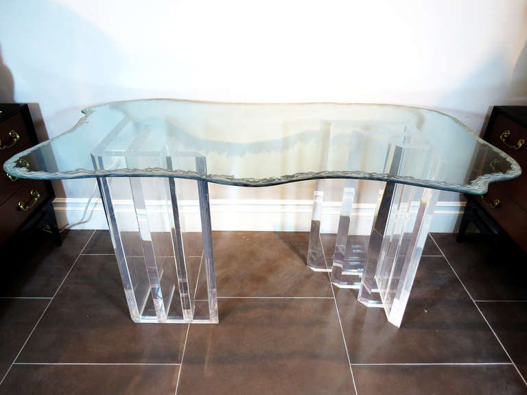 This stylish waved glass top sits on two lucite pedestals.

Disclaimer: Please contact us in advance if you would like to view this item at our showroom. We have a large inventory and many of our items are stored at our warehouse.