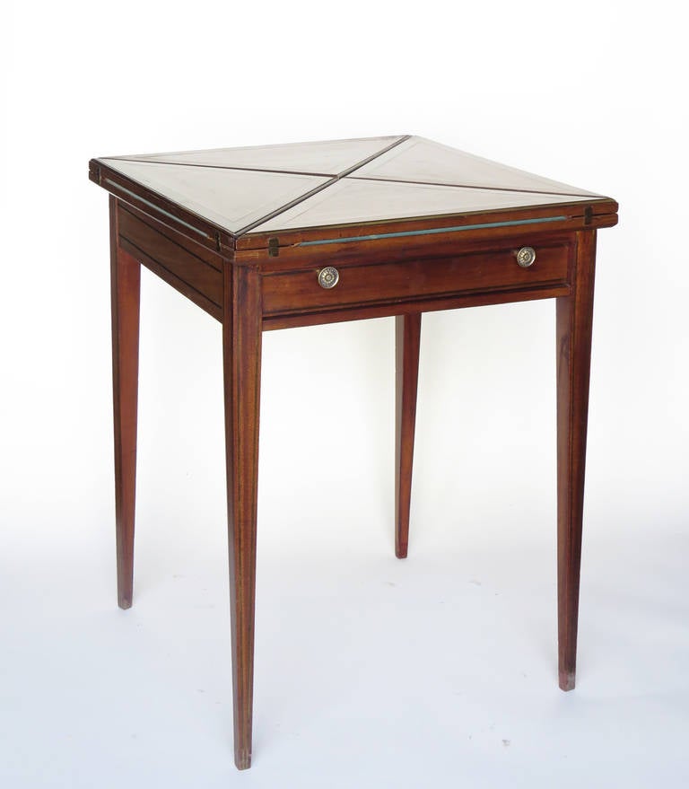 Vintage game table with pull out drawer and swiveling top.

The game table measures 29.5