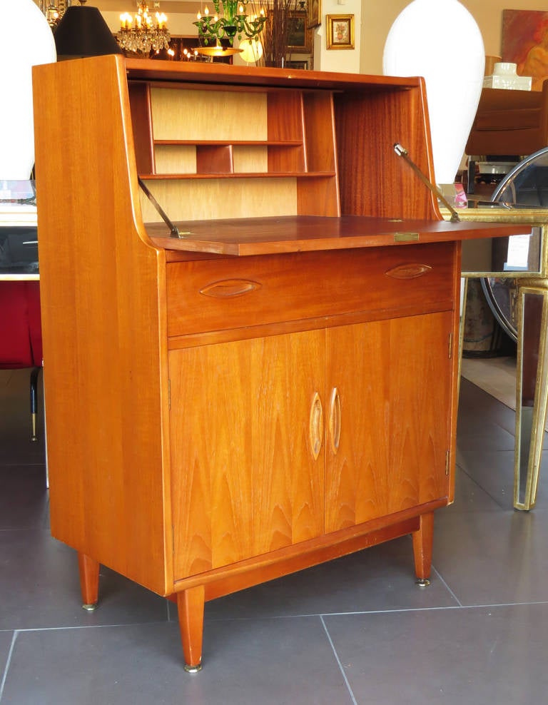 Elegant Mid-Century secretary made of teakwood.

Disclaimer: Please contact us in advance if you would like to view this item at our showroom. We have a large inventory and many of our items are stored at our warehouse.