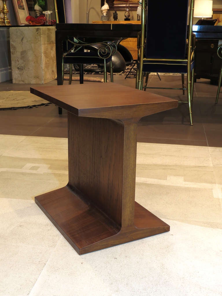 Very unique side table or stool in the shape of an I-beam. This item can serve as a nightstand, side table, or a stool. The finish on the piece is immaculate.