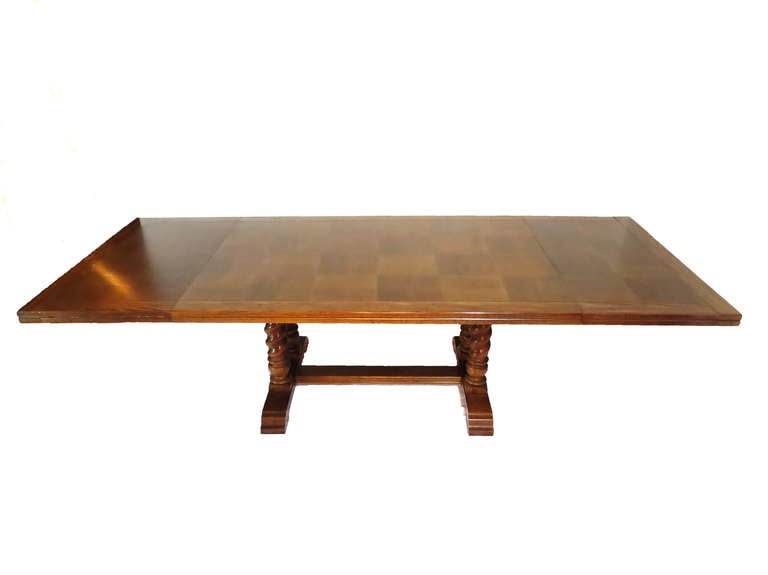 Gorgeous dining table made of oak and fruit wood veneer. Legs are twisted columns and are made of solid oak. Dark walnut finish. 

Also includes two leaves that measure 20