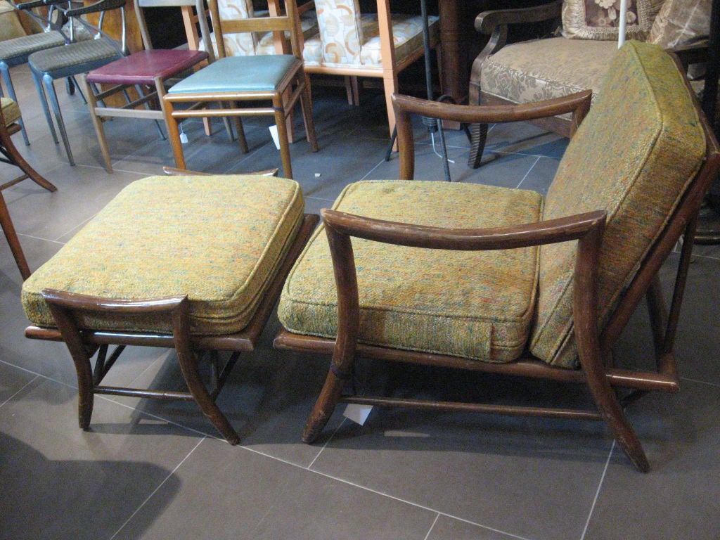 Beautiful both in terms of aesthetic as well as construction, the dark wood 'bamboo' frame for this matching chair and ottoman is exquisite. The upholstery is attractive and in step with the period of this piece, although it is recommended it be