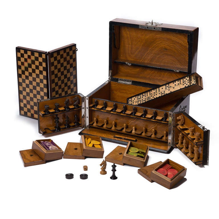 Fine quality English games comendium circa 1850.
Cased in circassian walnut with fine quality exterior metalwork.
All original game pieces intact.