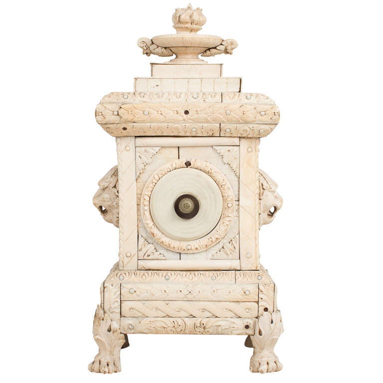 A highly decorative carved Dieppe mantle clock in the classical style with lion mask appliques and paw feet.
France circa 1840.