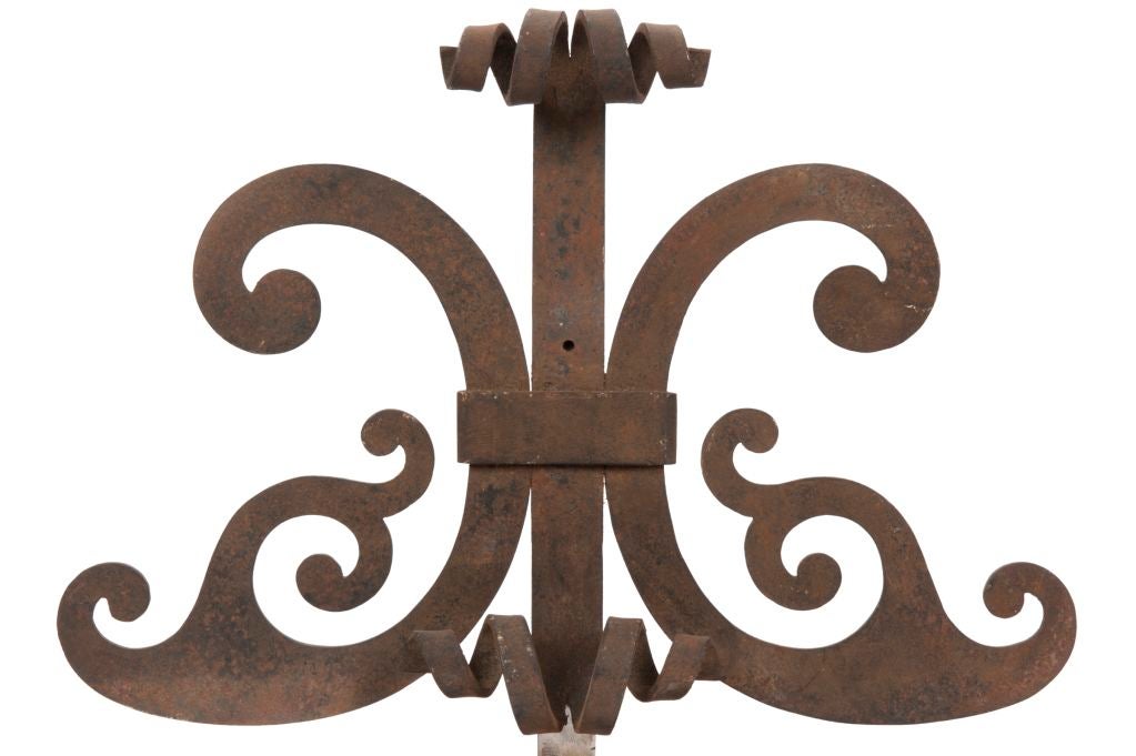 Finely wrought iron architectural elements mounted on contempory steel bases.