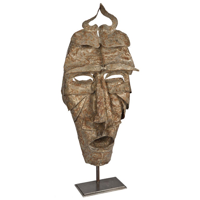 Mounted Sculptural Metal Mask For Sale