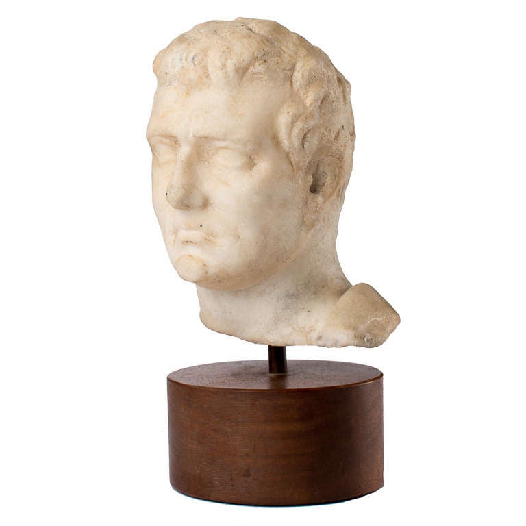 Period Hellenistic Roman marble bust of a man, c. 334-324 B.C. A heroicizing idealization of the subject with youth, beauty and benevolence put to full use by sculptor. Many emperors of this period used sculpture as a tool for communicating specific