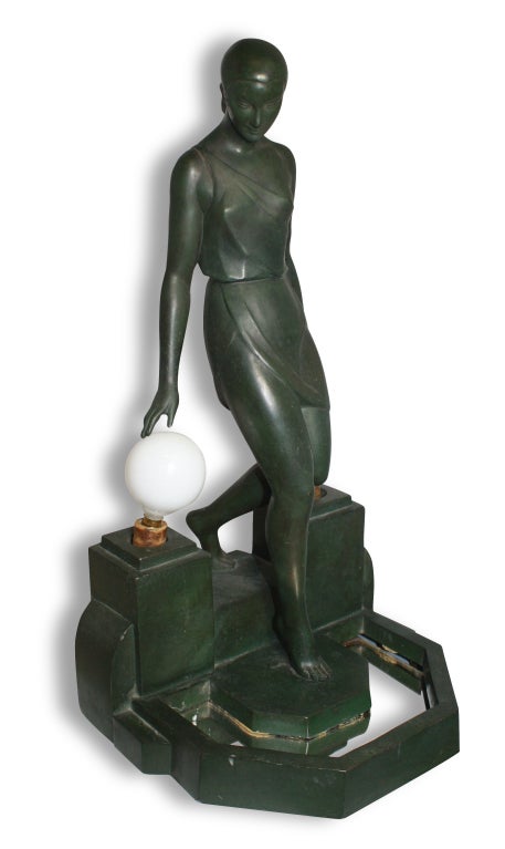 Fine quality patinated metal figural desk lamp of a stylised classical woman stepping into a pool, flanked by two later frosted glass bulbs, signed in the base Fayral. Sculpted by Pierre Le Faguays(1892-1935) and cast by the LeVerre foundry in the