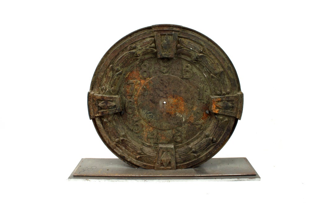 A well cast architectural elevator dial with original patina. Mounted on a later steel base. Great decorative item.