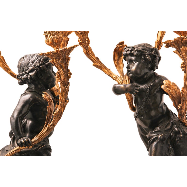 Beautifully detailed French Bronze and Gilt Candelabra depicting Cupid and a Satyr