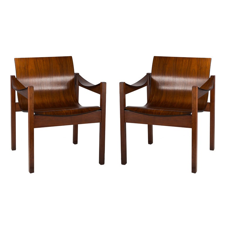 Pair of unique Mid-Century Modern Dutch walnut saddle armchairs.