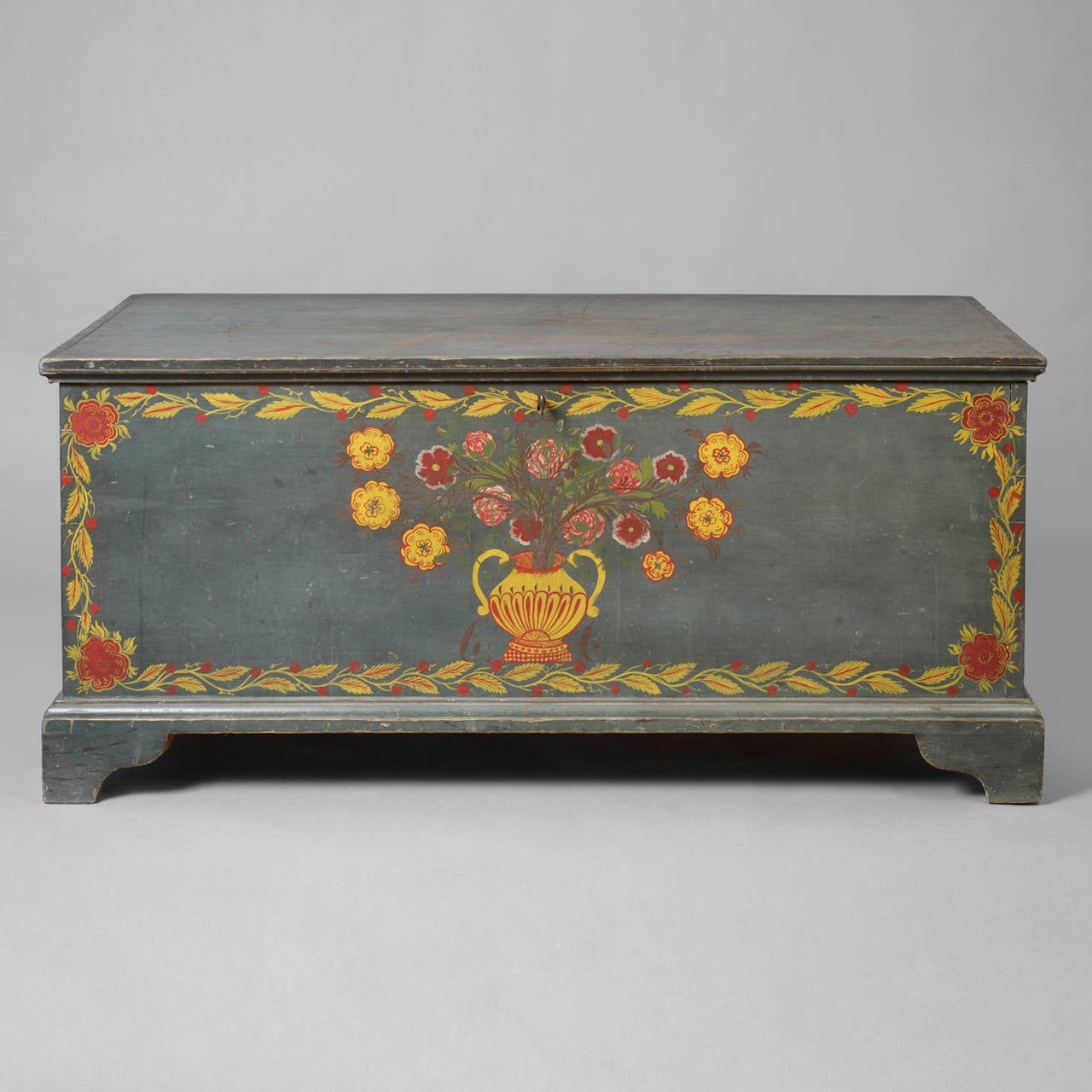 American. Schoharie or Albany County, New York, circa 1815-1830.
Pine, paint decorated, iron hinges.
Condition: Minor imperfections such as abrasions with very minor in-painting. The blanket chest has survived in a remarkable state of