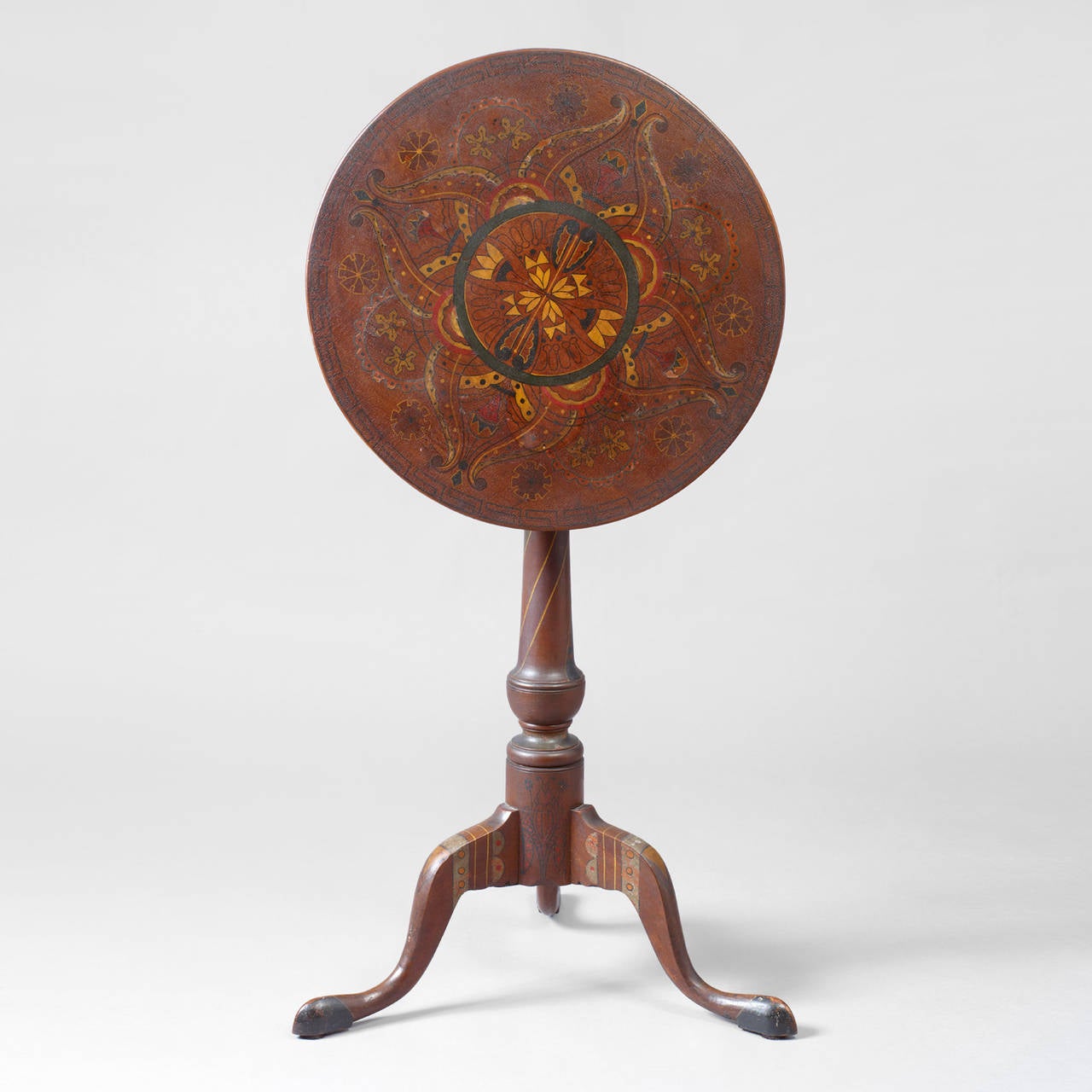 America. Pennsylvania, circa 1770. Paint decoration, 19th century.
Walnut, polychrome paint decoration.
Condition: The candlestand is in fine condition, minor losses to some of the paint decoration on the top.

Very seldomly do we see the