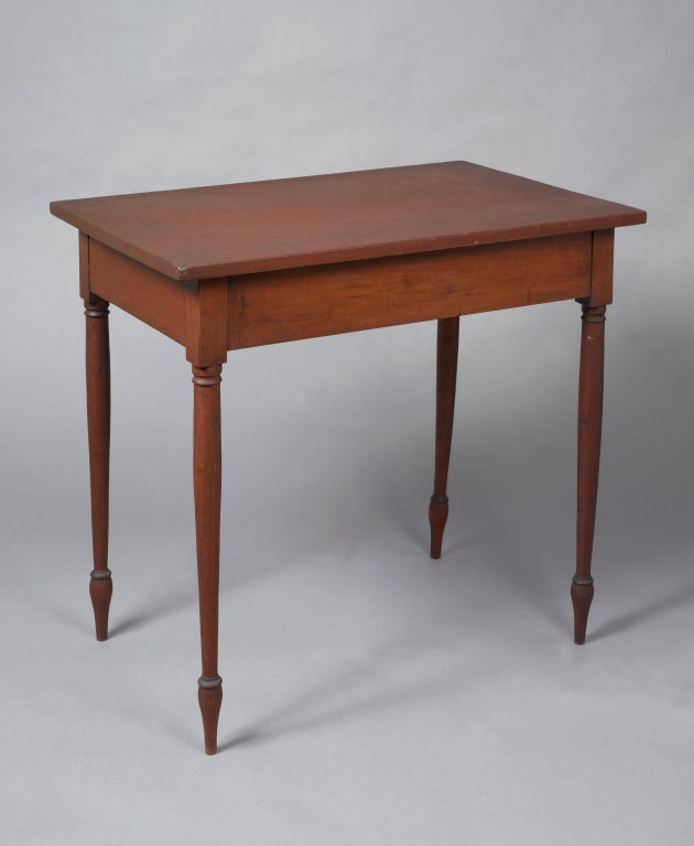 New England, probably New Hampshire, circa 1820
A rare form having a slightly over-hung top with a straight skirt supported by tall delicately turned legs ending on turned feet.