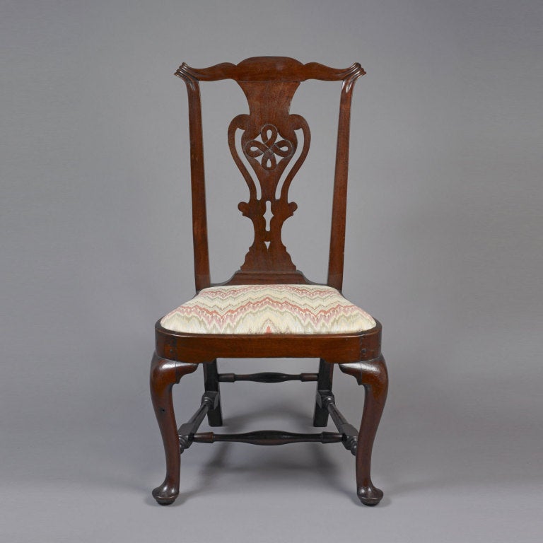 Rare and possibly unique transitional Chippendale balloon
Seat side chair, probably Massachusetts, circa 1765-1775.
The chair has the combination of an unusually carved
and pierced Chippendale splat and carved crest rail above a balloon seat and