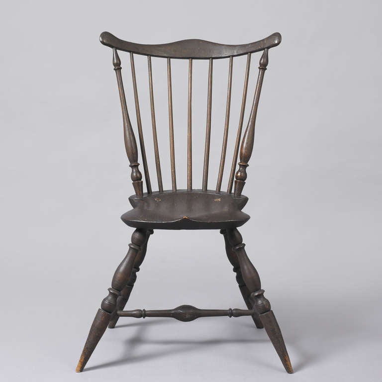 Rhode Island, ca. 1780-1795.
Mixed woods; Ash, maple, chestnut
Excellent condition, retains a dry mid-19th c. painted and varnish surface.
Superb form, having a shaped crest above spindles with a well defined saddle-seat supported by bulbous
