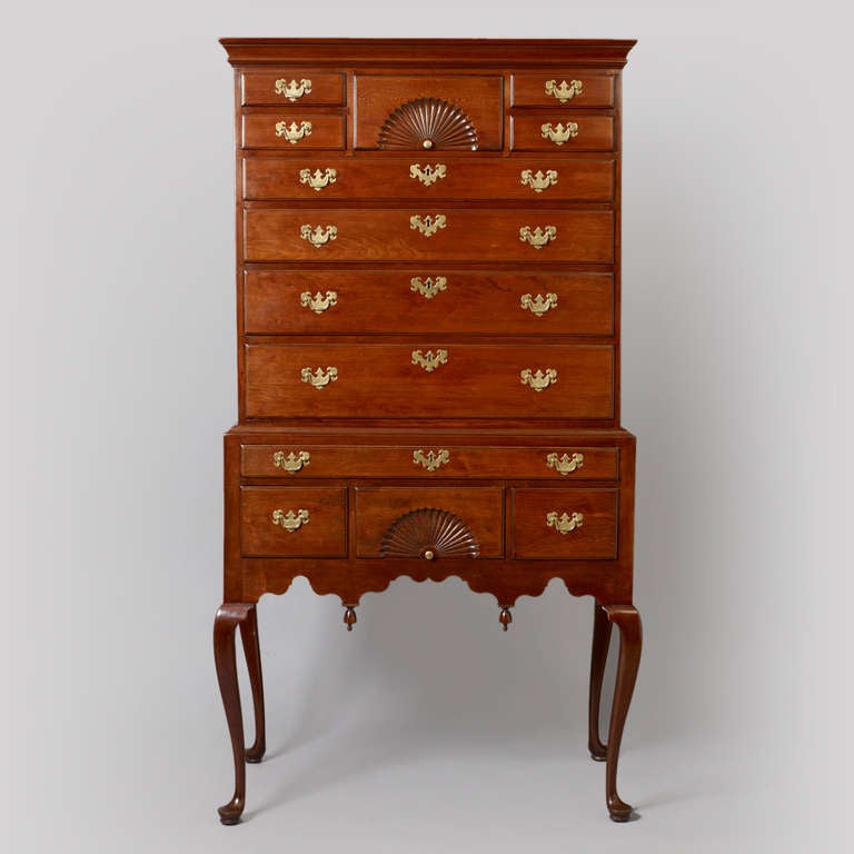 Connecticut, Probably Wethersfield, circa 1750-1775. Cherry; Secondary wood: eastern white pine. This fine example exhibits great proportions to the case with finely executed twin carved fans. These attributes are more commonly found from cabinet