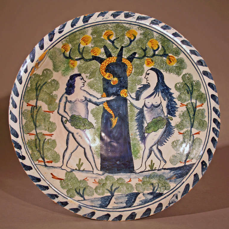 Adam and Eve delft charger with the tree of life and snake. English, probably London, circa 1680-1700. Ceramic, lead glaze on back, white tin glaze and polychrome on front. Excellent condition, with minor restoration to the foot ring, slight hair