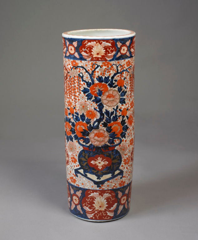 Imari Umbrella Stand, Chinese or Japanese, ca. 1850.
Cylindrical form with a wide central band depicting an urn of flowers flanked by wide floral borders.
