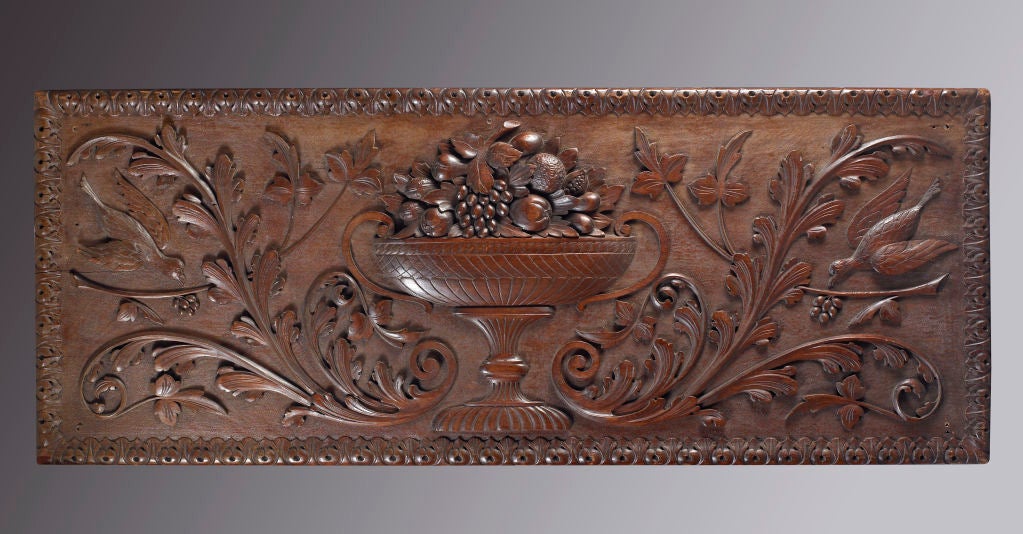 Carved Over-mantle Panel Depicting a Compote with Fruit Flanked by Birds, probably Pennsylvania, circa 1850-1860. Carved from a solid piece of poplar with some applied carving.  Finely carved with great symmetrical design.