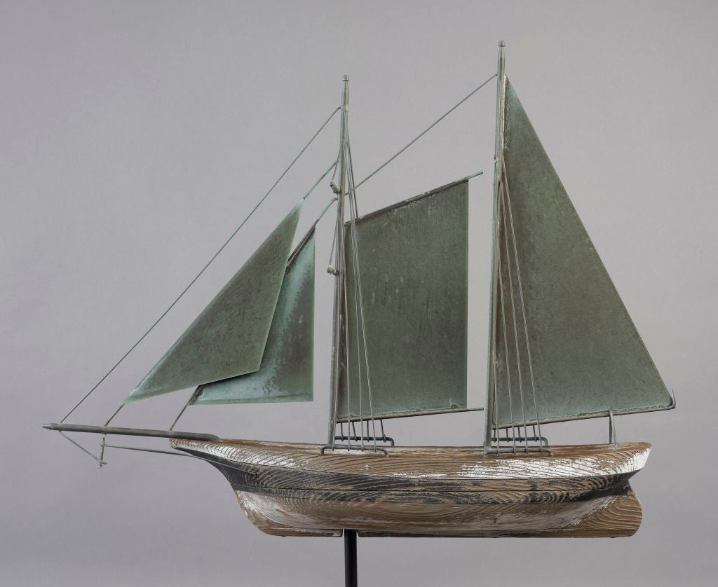 American, probably New York, ca. 1920-1930.<br />
The two masted sailing vessel is rare for being made of both copper and carved wood. It appears to be a non-manufactured weathervane making it more unique.
