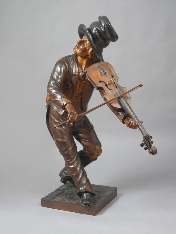 American, probably New York.
This rare and possibly unique carving of a street performer playing a violin shares many qualities and characteristics to the works of Charles Dodge, New York (1806-1886). The Violin Player closely relates to the