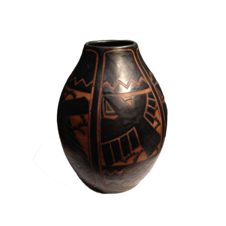 Beautiful Art Deco vase by Boch Freres designed by Charles Catteau at Atelier de Fantasie. Vase is depicted in a two- color design with stylized sparrowhawks, and geometric upper and lower friezes on stoneware in black and terracotta. This piece was