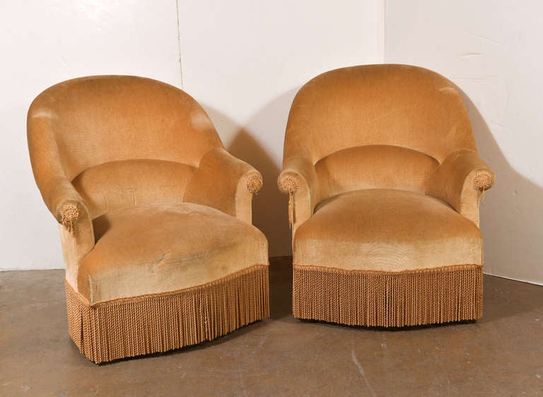 Pair of Barrel Back Lounge Chairs, 
with bullion skirt
28