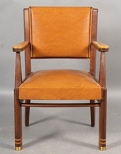 Pair of French Art Deco Armchairs with leather upholstery, 
stylized legs with banding and brass capped feet.