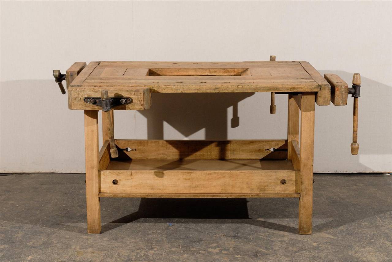 This very unusual European workbench is made of four sides with adjustable clamping mechanisms. It also has a nice storage area on the underside. 

This would make a fantastic kitchen island with, oh why not, a small easel for a recipe book in the