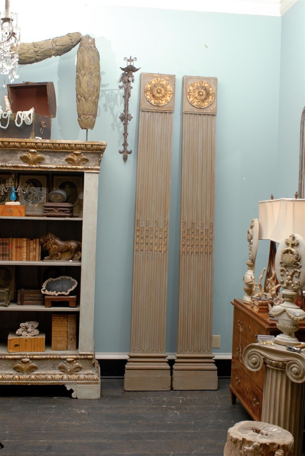 A gorgeous pair of Italian 19th century pilasters or flat columns, fluted in the top part, alternating with reeding in the lower part. The gilded elements in the capitals and center part of the body, add to the general elegance. Perfect for adding a