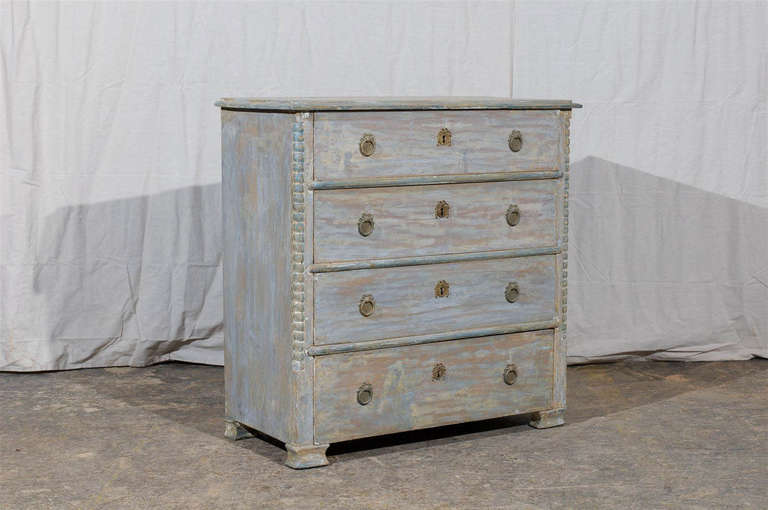 A stunning Swedish 19th century Karl Johan a four-drawer painted wood chest with beaded edges and block feet. 

The Karl Johan period follows the Gustavian period in Sweden.