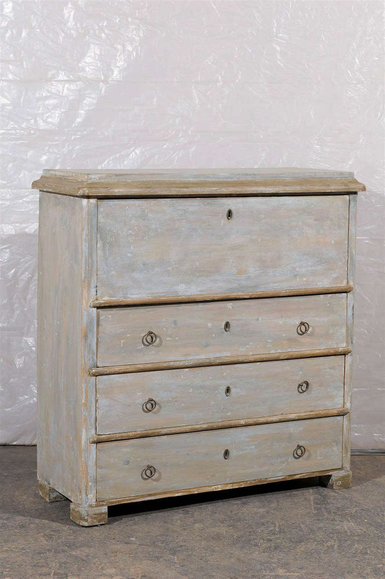 A Swedish mid-19th century Karl Johan drop front painted wood desk with three lower drawers and multiple drawers in the desk portion. Block feet wrapping around the corner.

The Karl Johan period follows the Gustavian period in Sweden.