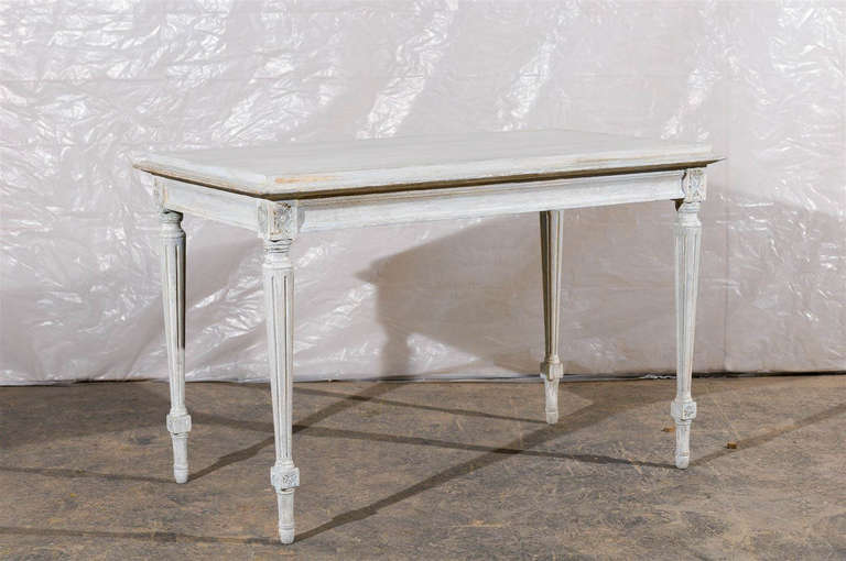 A Swedish Gustavian style painted wood console/sofa table with Rosettes, fluted and tapered legs. Early 20th century.