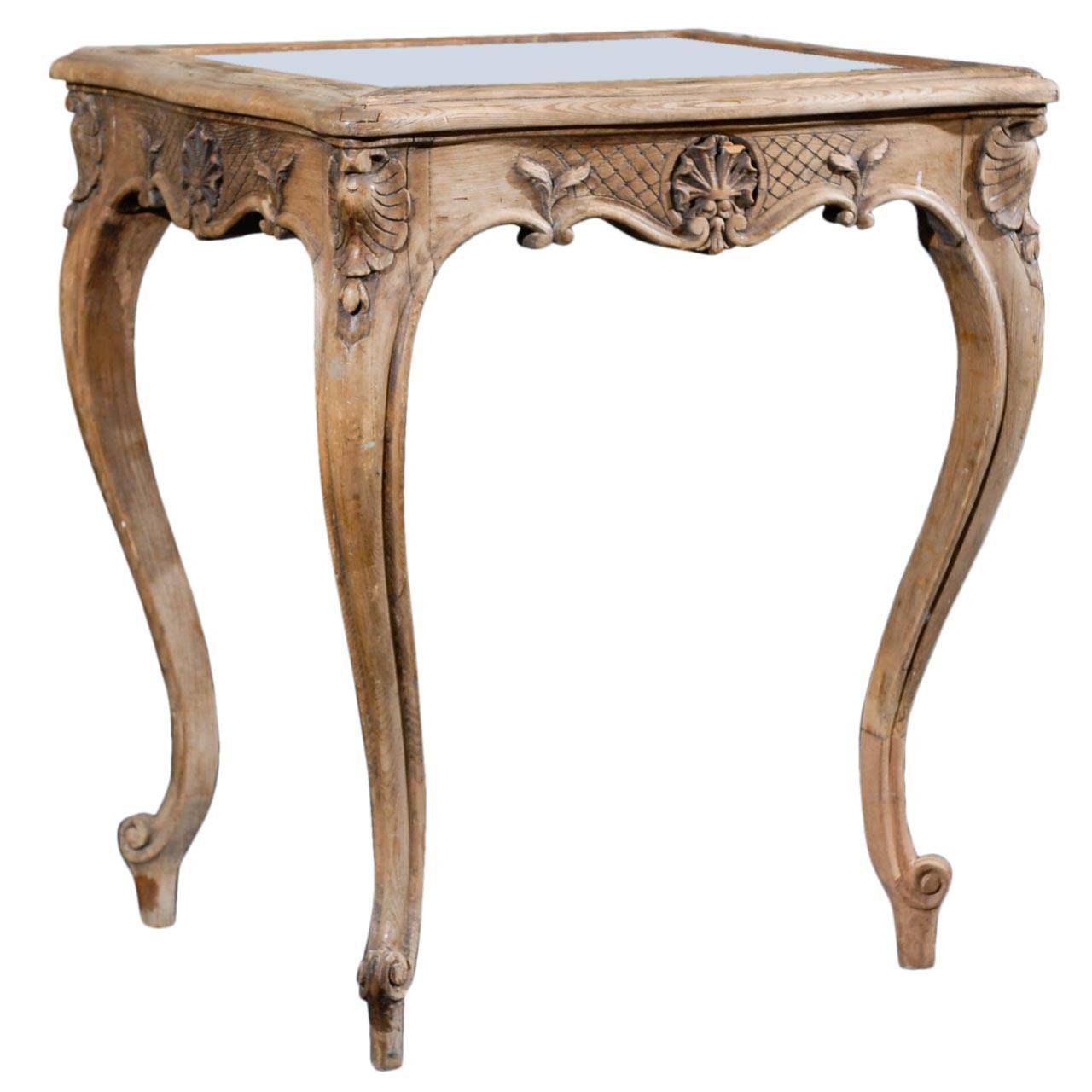 A gorgeous 19th century French wooden side/drinks table with mirrored top and scrolled cabriole legs. This cute French side/drinks table has nice leaf motif, scolls and cross hatched carvings throughout its apron. This piece is an overall light