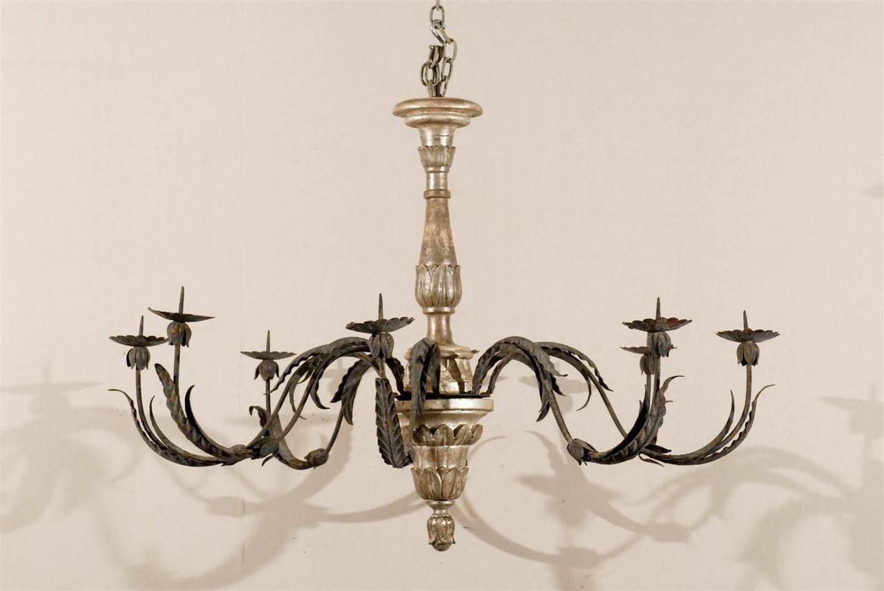 A 19th century Italian eight-light silver gilt chandelier with leaf arms and flower shaped bobeches.

This chandelier is unwired.