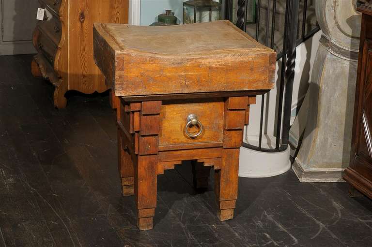 This is a European chopping block table with one large drawer.  Nice old wear!